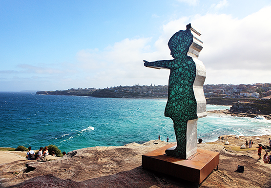 Girl Pointing, by Matt Calvert. at the Scupture by the Sea exhibition on the Bondi to Tamarama coastal walk, Sydney